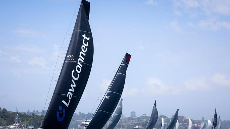 LawConnect, left, leads the fleet during the start of the...