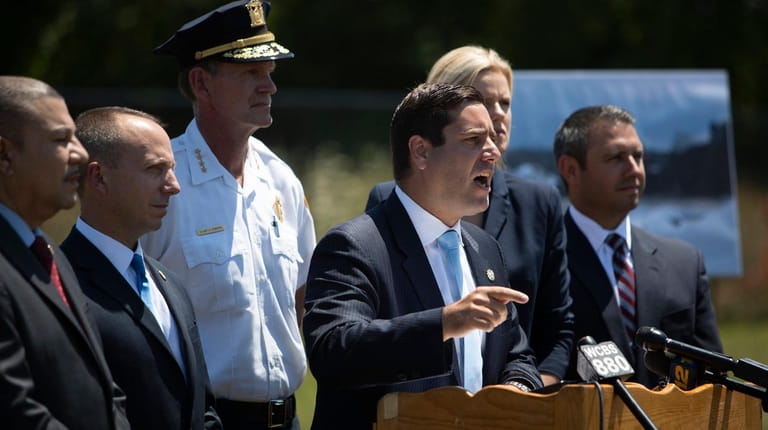 Timothy Sini, Suffolk District Attorney, speaks during a press event...