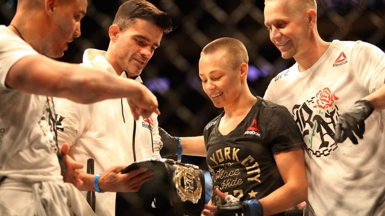 Rose Namajunas celebrates her first-round knockout for the upset win...