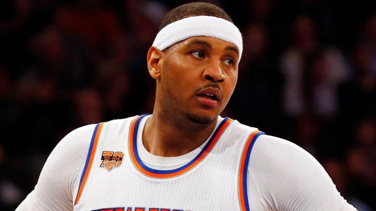 Carmelo Anthony of the New York Knicks looks on in...
