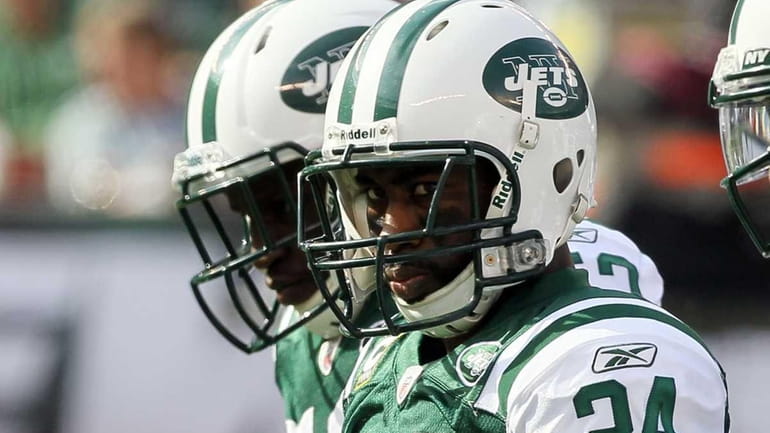 Darrelle Revis of the New York Jets looks on against...