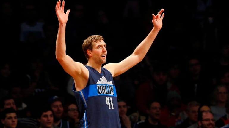 Dirk Nowitzki of the Dallas Mavericks reacts during a game...