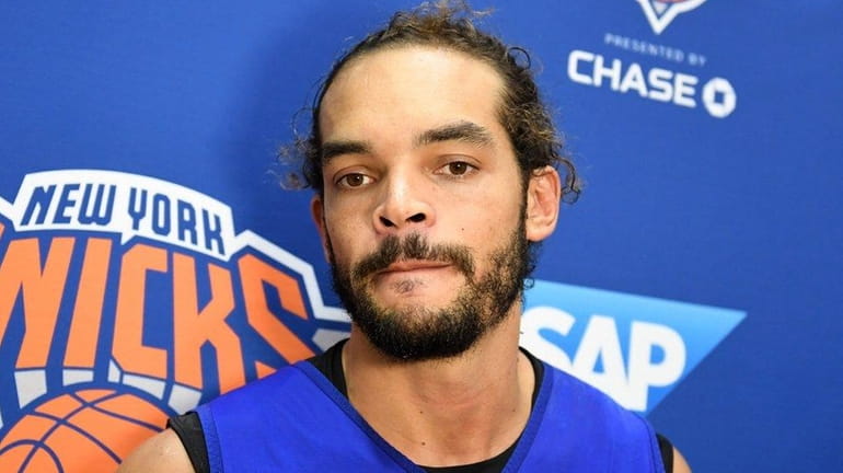 Joakim Noah speaking to the media after practice at training...