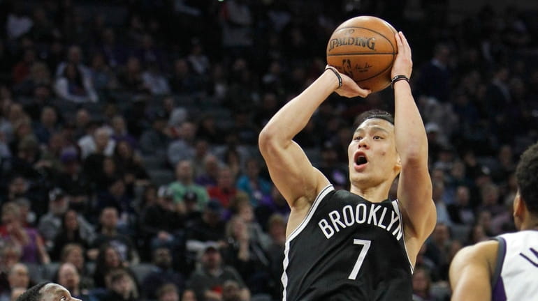 Brooklyn Nets guard Jeremy Lin (7) shoots over Sacramento Kings...
