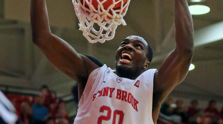 Stony Brook's Jameel Warney dunks the ball in the second...