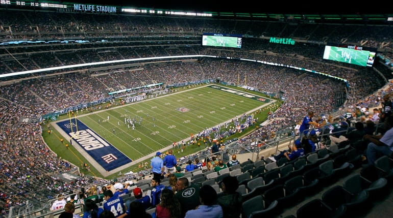 Fans at MetLife Stadium watch the second half of a...