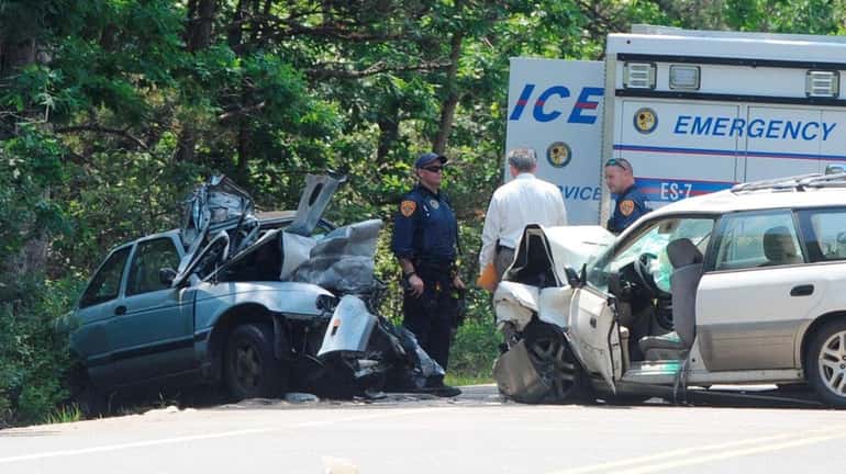 Police at the scene of a fatal crash where the...