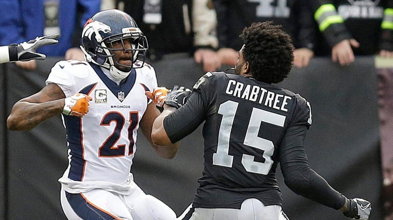 Broncos cornerback Aqib Talib fights Raiders wide receiver Michael Crabtree...