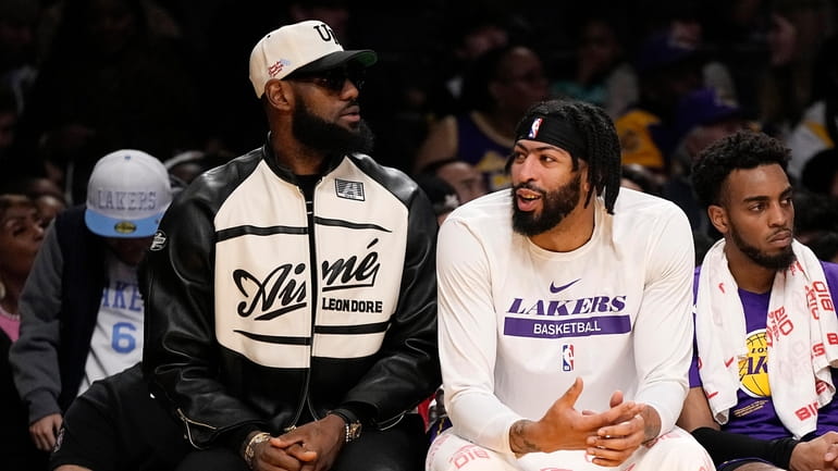 Los Angeles Lakers' LeBron James, left, and forward Anthony Davis...