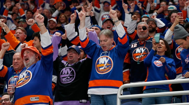 Islanders fans celebrate a third-period goal against the Flames at UBS...