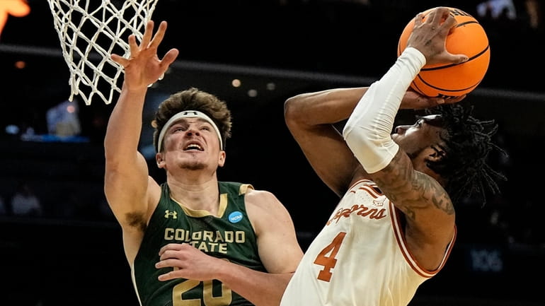 Texas guard Tyrese Hunter (4) shoots against Colorado State guard...
