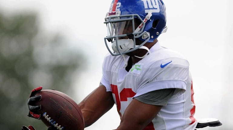 Giants wide receiver Rueben Randle catches a pass during team...