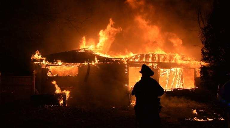 A fire engulfed a vacant house in Copiague on Thursday,...