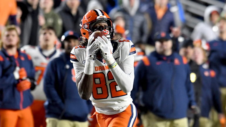 Syracuse's wide receiver Damien Alford hauls in a pass and...