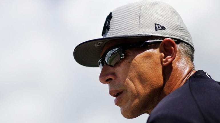 Yankees manager Joe Girardi watches from the dugout during the...