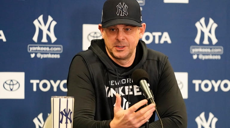 New York Yankees manager Aaron Boone answers questions at spring...