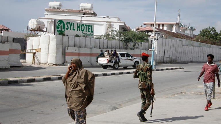 Somali security forces guard the entrance to the SYL hotel...