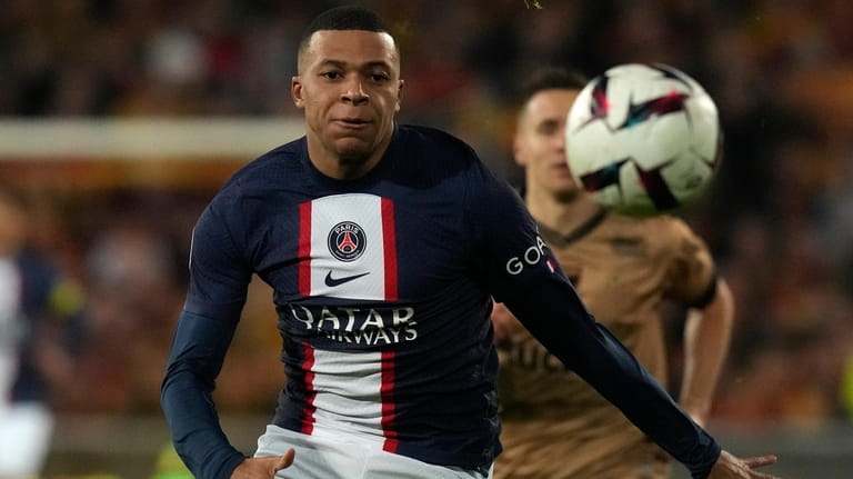 PSG's Kylian Mbappe races after the ball during the French...