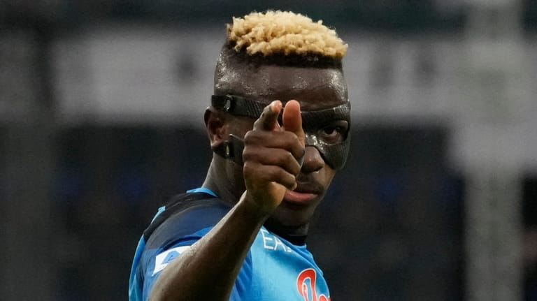 Napoli's Victor Osimhen celebrates after scoring during the Serie A...