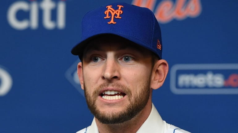 New York Mets' Jed Lowrie speaks during his introductory press...