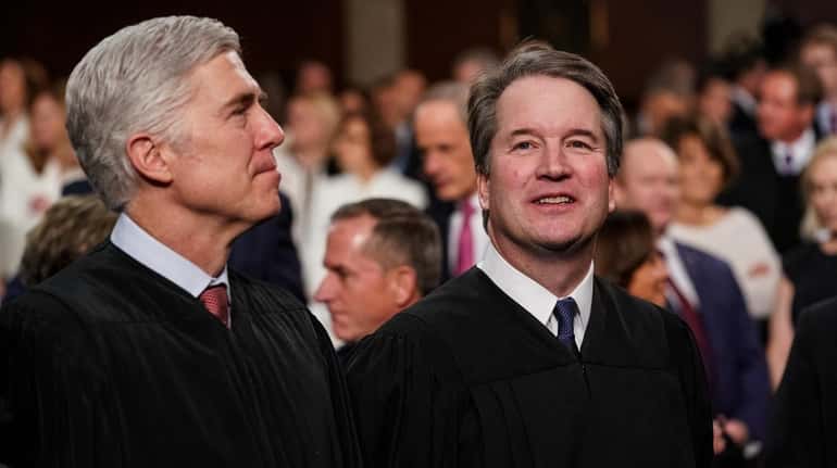 Supreme Court Justices Neil Gorsuch and Brett Kavanaugh attend the...