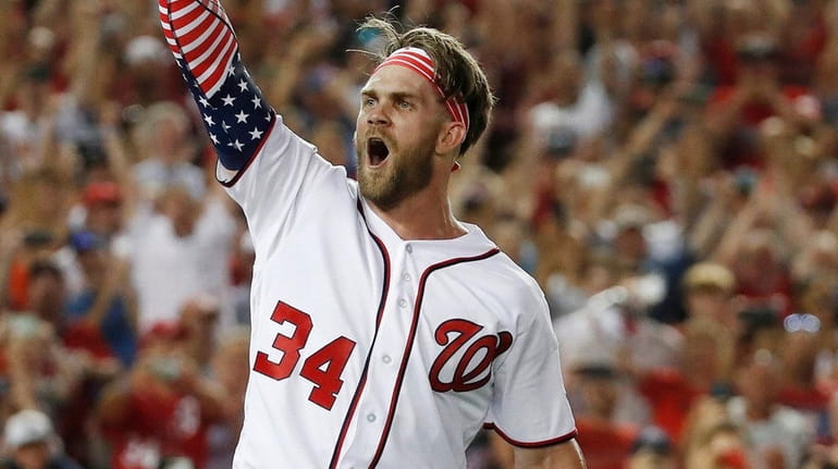 Nationals outfielder Bryce Harper reacts to his winning home run...