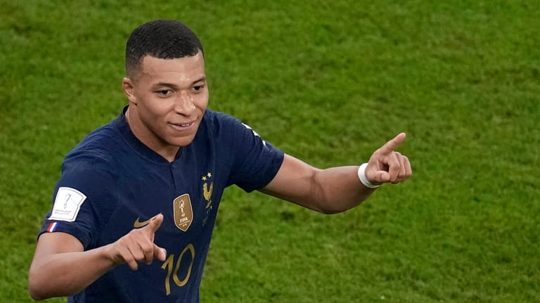 France's Kylian Mbappe celebrates after scoring his side's second goal...
