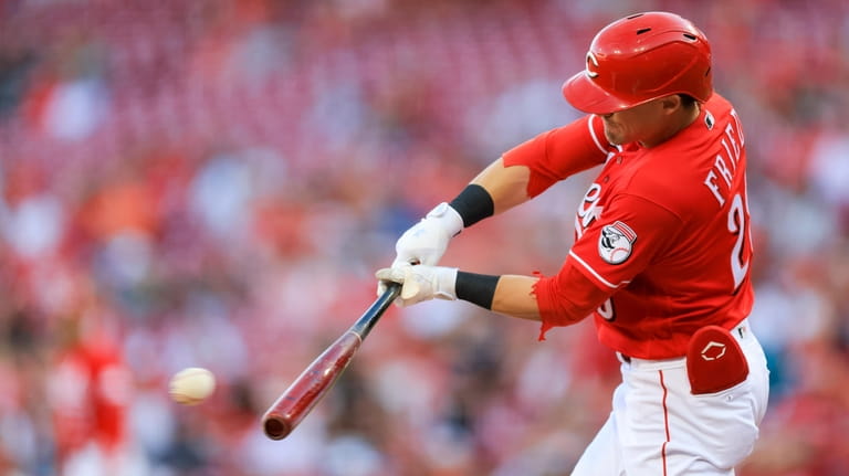 Cincinnati Reds' TJ Friedl hits a single during the first...