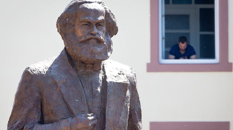 A bronze statue of Karl Marx is unveiled Saturday in...