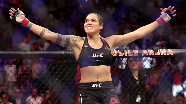 Champion Amanda Nunes reacts after defeating Holly Holm during their...
