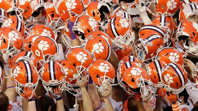 In this Jan. 7, 2019, file photo, Clemson players huddle...