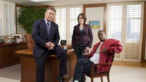 From left, Alec Baldwin as Jack Donaghy, Tina Fey as...