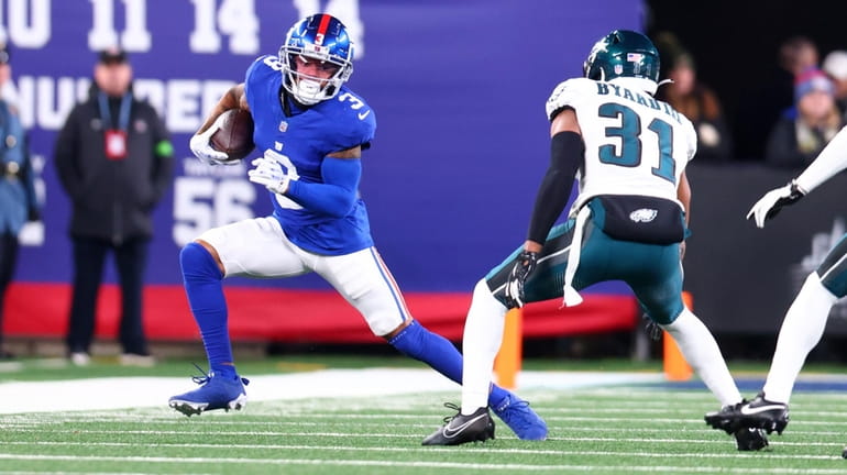 Sterling Shepard #3 of the New York Giants runs with...