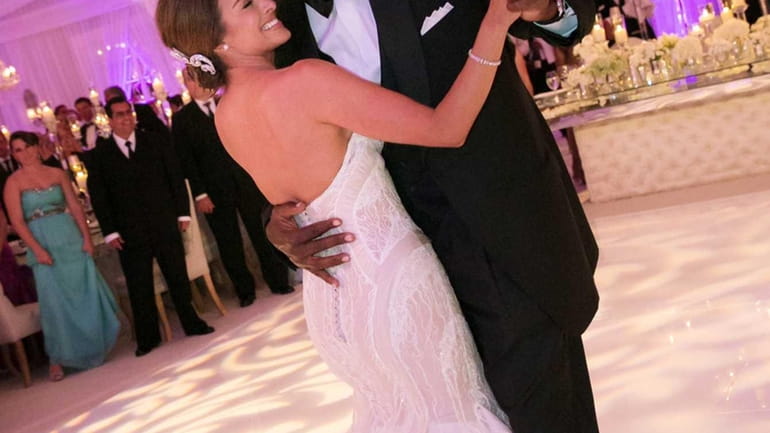 Michael Jordan dances with his bride, Yvette Prieto, during their...