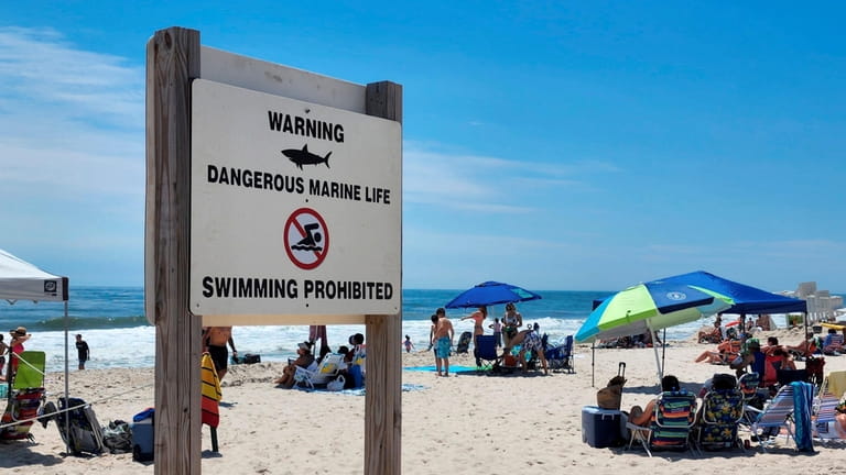A swimming prohibited sign at Smith Point Beach in Shirley...