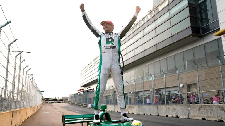 Alex Palou celebrates winning the IndyCar Detroit Grand Prix auto...