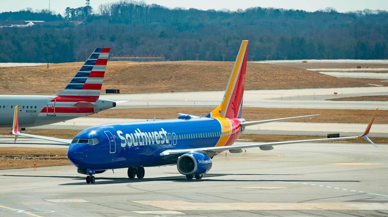 A Boeing 737 Max 8 flown by Southwest Airlines taxis...