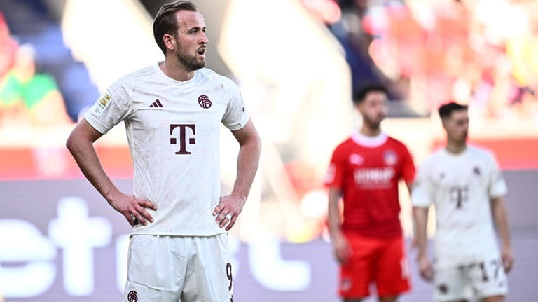 Munich's Harry Kane reacts after the German Bundesliga soccer match...