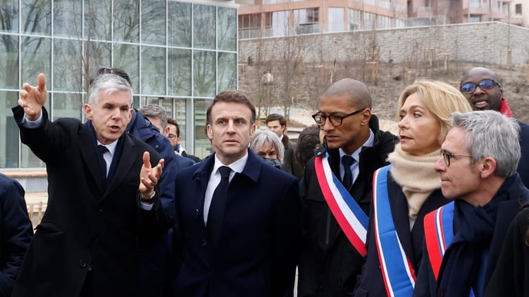 France's President Emmanuel Macron, center left, and General Manager of...