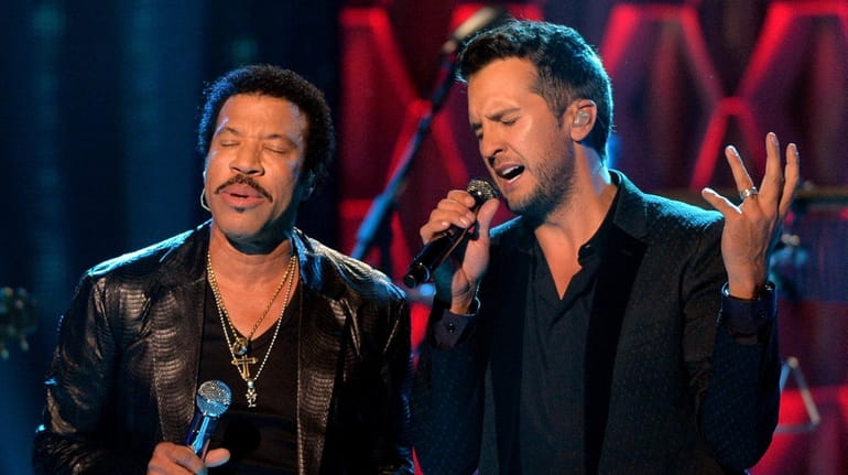 Lionel Richie, left, and Luke Bryan perform at CMT Artists...
