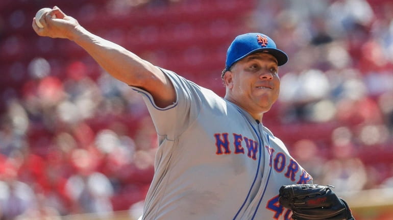 New York Mets starting pitcher Bartolo Colon throws in the...
