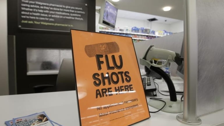 A sign telling customers that they can get a flu...