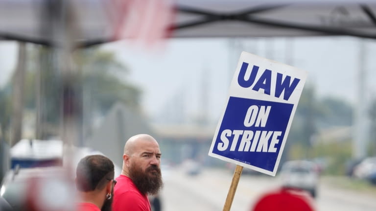 United Auto Workers union members strike for improved compensation outside...