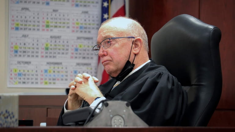 Judge Patrick McAllister listens to arguments during a hearing in...