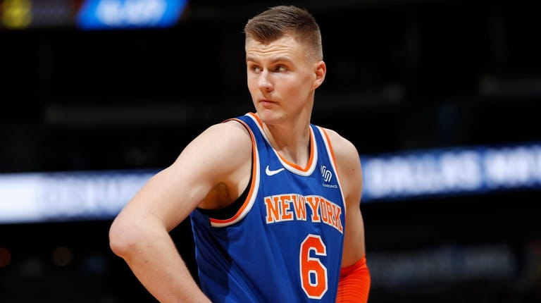 Knicks forward Kristaps Porzingis reacts after fouling out against the...