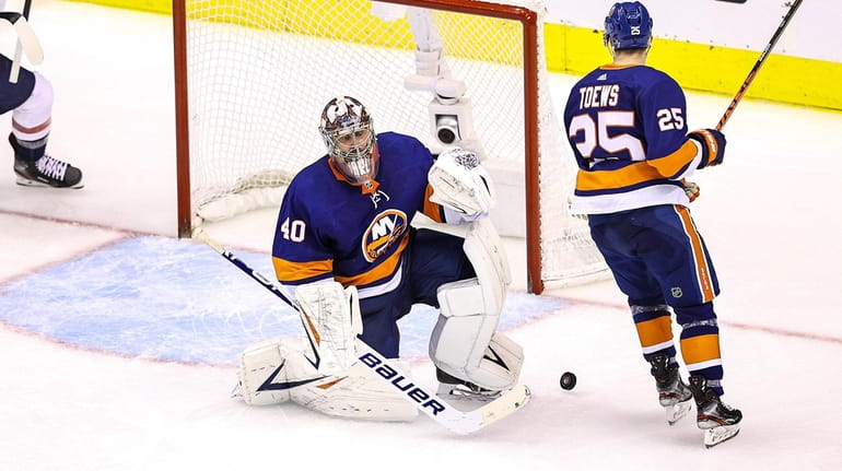 Semyon Varlamov #40 of the Islanders allows a goal to Alex...