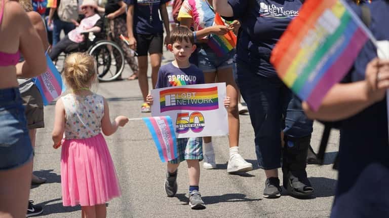 Participants at the Long Island Pride Parade in 2019 celebrating...
