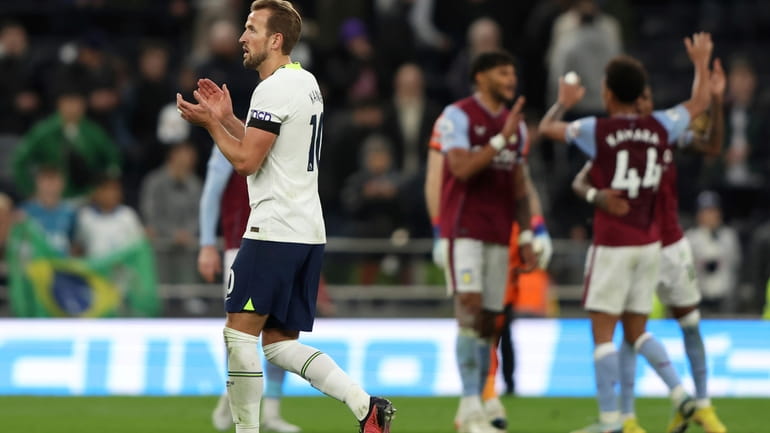 Tottenham's Harry Kane acknowledges the fans after their loss in...
