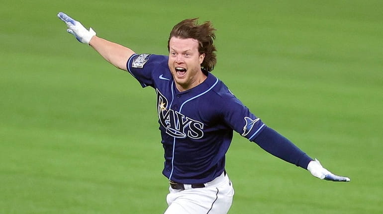 Brett Phillips of the Tampa Bay Rays celebrates after hitting a...