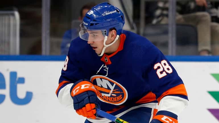 Michael Dal Colle #28 of the Islanders skates against the Buffalo...